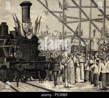 Inauguration of a direct rail from Madrid to Ciudad Real. The Cardinal Archbishop of Toledo bless the locomotive 'Badajoz' (1879), in the presence of King Alfonso XII. Engraving in The Spanish and American Illustration. Stock Photo