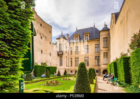 Jardin Lazare-Rachline is a small formal garden in the Marais district of Paris, France Stock Photo