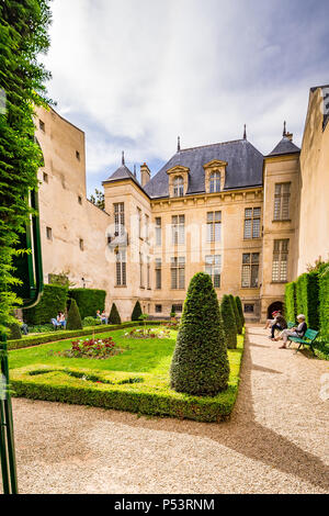 Jardin Lazare-Rachline is a small formal garden in the Marais district of Paris, France Stock Photo