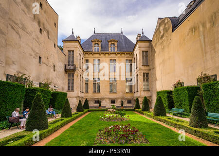 Jardin Lazare-Rachline is a small formal garden in the Marais district of Paris, France Stock Photo