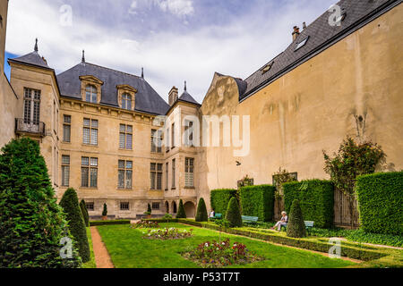 Jardin Lazare-Rachline is a small formal garden in the Marais district of Paris, France Stock Photo