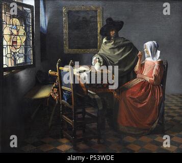 Johannes Vermeer (1632-1675). Dutch painter specialized in domestic interior scenes of middle class life. The wine glass, c. 1658-1660. Also known as The Glass of Wine or Lady and Gentleman Drinking Wine. Oil on canvas. Gemaldegalerie. Berlin. Germany. Stock Photo