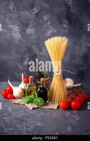 Pasta, tomatoes, olive oil and vinegar Stock Photo