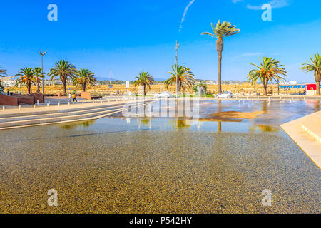 Fountains in town square near Santa Maria Church on the promenade with palm trees of Lagos in Algarve, Portugal, Europe. Stock Photo