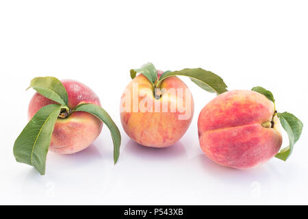 Three Peaches  Isolated on White Background. Stock Photo