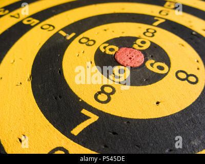 diagonal view of an used dartboard Stock Photo