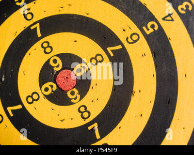 diagonal view of an used dartboard Stock Photo