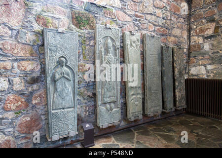 The gravestones of former Scottish Kings displayed inside the Abbey on the Hebridean island of Iona, Argyll and Bute, Scotland, UK Stock Photo