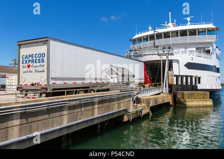 A Cape Cod Express semi-tractor trailer drives aboard a Steamship Authority ferry in Vineyard Haven on Martha's Vineyard, headed for the mainland. Stock Photo