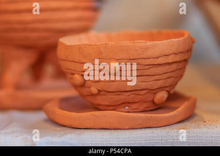 Beautiful handmade ceramic pot and vase in exotic patterns at night market. Stock Photo