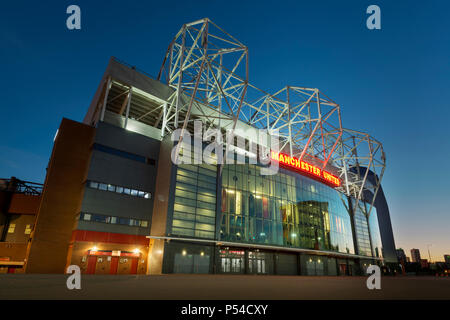 Old Trafford stadium, home of Manchester United Football Club, during a summer's evening (Editorial use only). Stock Photo