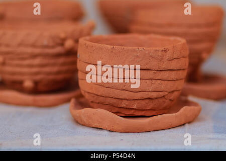 Beautiful handmade ceramic pot and vase in exotic patterns at night market. Stock Photo