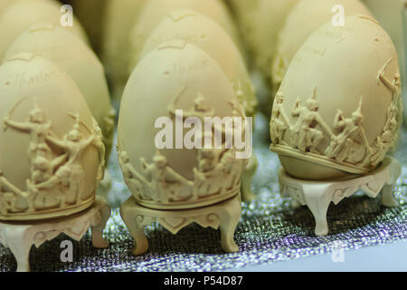 Beautiful Ester egg with Thai pattern. Handwriting inscription Happy Easter in Thai Style patterns. Stock Photo