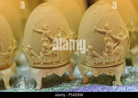 Beautiful Ester egg with Thai pattern. Handwriting inscription Happy Easter in Thai Style patterns. Stock Photo