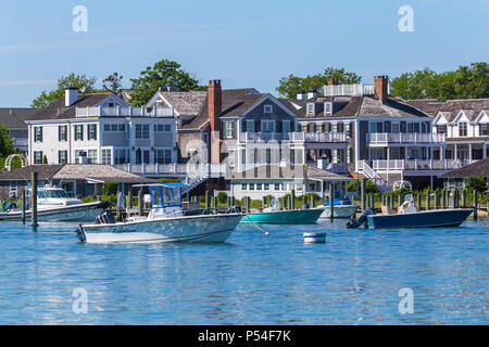 Boats moored and docked in the harbor, overlooked by stately sea captains' homes in Edgartown, Massachusetts on Martha's Vineyard.