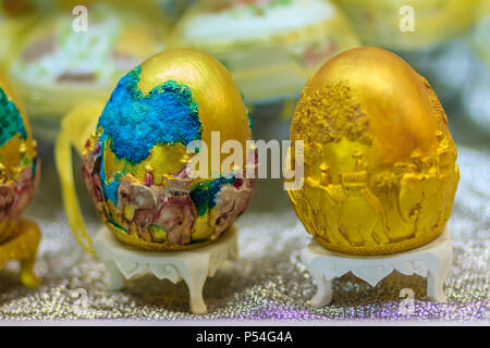 Beautiful Ester egg with Thai pattern. Handwriting inscription Happy Easter in Thai Style patterns. Stock Photo