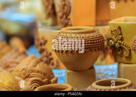 Beautiful handmade ceramic pot and vase in exotic patterns at night market. Stock Photo