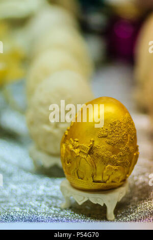 Beautiful Ester egg with Thai pattern. Handwriting inscription Happy Easter in Thai Style patterns. Stock Photo