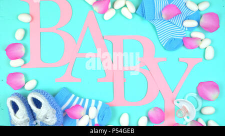 Pink and blue baby overhead decorated by nursery accessories and letters spelling the word, Baby. Stock Photo