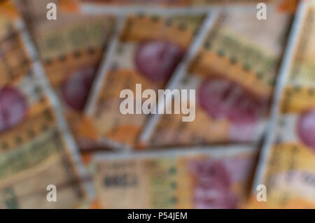 Blurred 200Rs Indian Currency notes forming a background Stock Photo