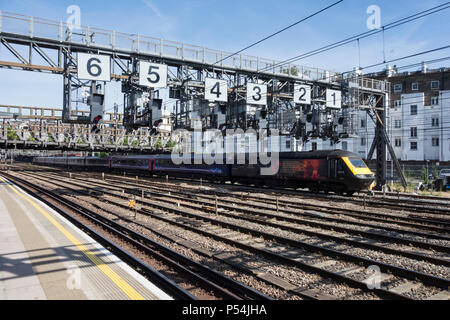 A Hitachi GWR High-Speed Train (HST) passing under the Royal Oak signaling gantry on leaving Paddington Station, London, UK Stock Photo