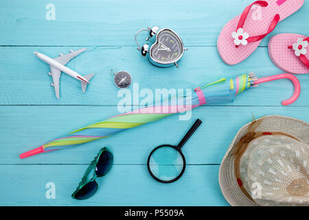 Summer background of summer objects and accessories for holiday time on wooden plank image for summer and travel background Stock Photo