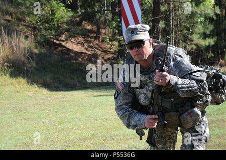 Staff Sgt. Keith Tollers, an advanced individual training platoon sergeant entry, makes his way to a simulated casualty during a medical event of the CASCOM Ultimate Warrior Competition May 9 at the installation range complex. Stock Photo