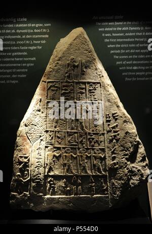 Tomb stele of the man Ib. At the top, Ib with a staff and bellow him the members of his family. Limestone. First Intermediate Period. C. 2150-2050 BC. Ny Carlsberg Glyptotek Museum. Copenhagen. Denmark. Stock Photo