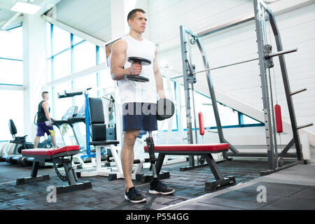 Man with Prosthetic Leg Training in Gym Stock Photo