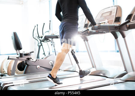 Muscular Man Working Out on Treadmill Stock Photo