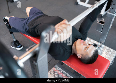 Handicapped Man Running on Treadmill Stock Photo