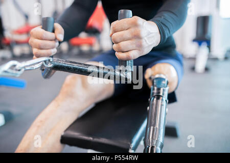 Adaptive Athlete Using Rowing Machine Close up Stock Photo