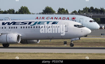 Richmond, British Columbia, Canada. 17th June, 2018. Airliners from Canada's two largest airlines, WestJet Airlines and Air Canada, at Vancouver International Airport. Credit: Bayne Stanley/ZUMA Wire/Alamy Live News Stock Photo
