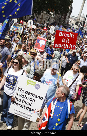 London, UK. 23rd June, 2018. Demonstrator seen holding placards and banners during the march.Pro-EU demonstrators in their tens of thousands flood Whitehall as the 'March for a People's Vote' heads the short distance from Pall Mall to Parliament Square. The march was organised by campaigners to call for the terms of the UK's eventual Brexit deal to be put before the British people in the form of a public vote. Exactly two years have now passed since Britain's deeply divisive referendum on EU membership, with the country due to leave the union in March 2019. (Credit Image: © David Stock Photo