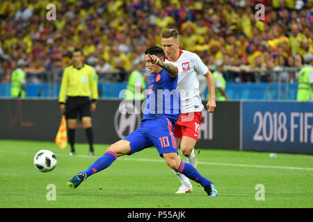 Kazan, Russland. 24th June, 2018. James RODRIGUEZ (COL), Action, duels versus Piotr ZIELINSKI (POL). Poland (PO) -Kolumbia (COL) 0-3, Preliminary Round, Group C, Match 31 on 24.06.2018 in Kazan, Kazan Arena. Football World Cup 2018 in Russia from 14.06. - 15.07.2018. | usage worldwide Credit: dpa/Alamy Live News Stock Photo