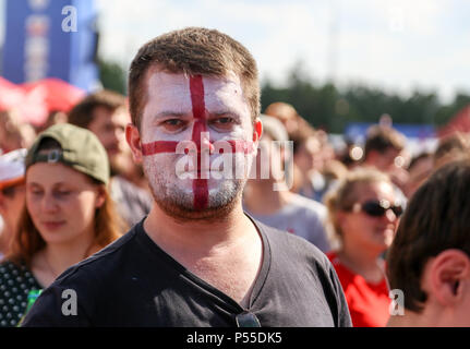 A fan of the England national team seen with his face painted in the colors of the national flag. Stock Photo