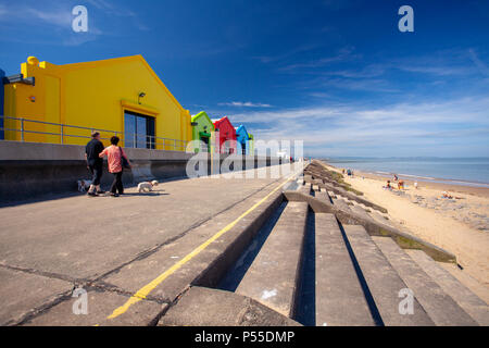 People enjoying a walk along Prestatyn Promenade and beach goers during a heat wave, North Wales, UK Stock Photo