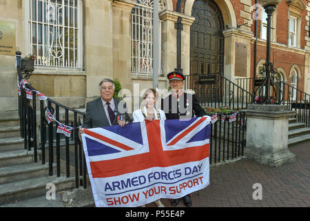 Aylesbury, United Kingdom. 25 June 2018. Earlier today Chairman Netta Glover was joined by County Councillors, Deputy Lieutenants, RAF personnel and other civic dignitaries in Market Square in the presence of Sir Henry Aubrey-Fletcher, HM Lord-Lieutenant of Buckinghamshire and Group Captain James Brayshaw, Station Commander at RAF Halton, to mark Armed Forces Day. The Armed Forces Flag was raised by Army Veteran Lieutenant Colonel John Williams of Bedgrove who served in the Royal Logistics Corps. Credit: Peter Manning/Alamy Live News Stock Photo