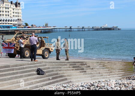 Llandudno, Wales. 25th June 2018.  The Royal engineers delivering the flag for the official  start of  the celebrations of  armed forces day in Llandudno, Credit: michael clarke/Alamy Live News Stock Photo