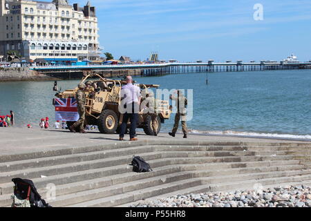 Llandudno, Wales. 25th June 2018.  The Royal engineers delivering the flag for the official  start of  the celebrations of  armed forces day in Llandudno, Credit: michael clarke/Alamy Live News Stock Photo