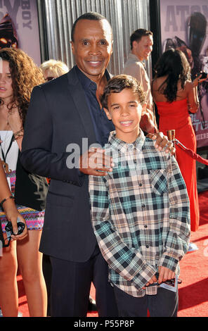 Sugar Ray Leonard, son  at the Real Steel Premiere at the Universal Amphitheatre In Los Angeles.Sugar Ray Leonard, son  31 ------------- Red Carpet Event, Vertical, USA, Film Industry, Celebrities,  Photography, Bestof, Arts Culture and Entertainment, Topix Celebrities fashion /  Vertical, Best of, Event in Hollywood Life - California,  Red Carpet and backstage, USA, Film Industry, Celebrities,  movie celebrities, TV celebrities, Music celebrities, Photography, Bestof, Arts Culture and Entertainment,  Topix, vertical,  family from from the year , 2011, inquiry tsuni@Gamma-USA.com Husband and w Stock Photo