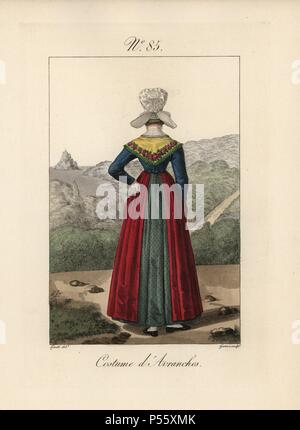 Costume of Avranches. Rear view of the bonnet in Plate 84, showing the small hairpiece chignon. Mont Saint Michel can be seen in the background. Hand-colored fashion plate illustration by Lante engraved by Gatine from Louis-Marie Lante's 'Costumes des femmes du Pays de Caux,' 1827/1885. With their tall Alsation lace hats, the women of Caux and Normandy were famous for the elegance and style. Stock Photo