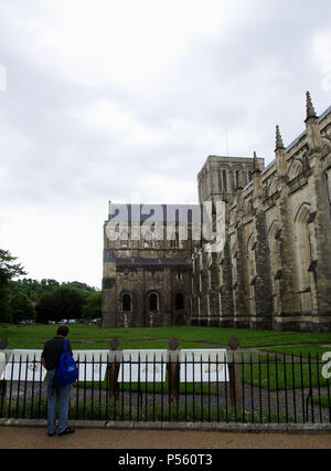 View of the long nave, central tower, north transept and west front of Winchester Cathedral, Hampshire, England, UK Stock Photo