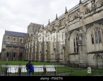 View of the long nave, central tower, north transept and west front of Winchester Cathedral, Hampshire, England, UK Stock Photo