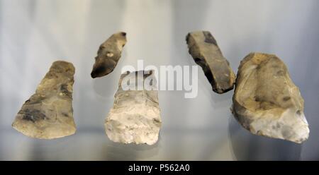 Stone tools including chopping tools, hand-axes, picks and spheroids, from  the Acheulean industry. Acheulean refers to an archaeological industry of  stone tool manufacture characterized by distinctive oval and pear-shaped  'hand-axes' associated with