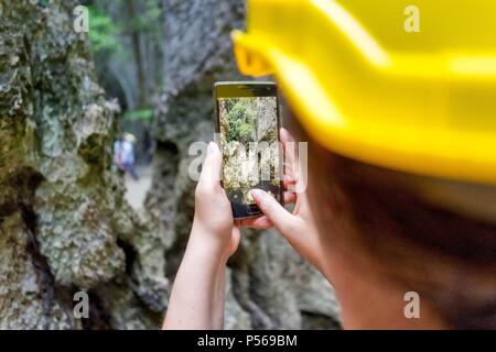 A hole in a rock gives a completely new view on what lays behind Stock Photo