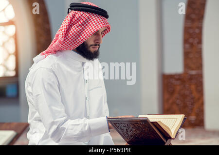 Religious muslim man praying inside the mosque Stock Photo