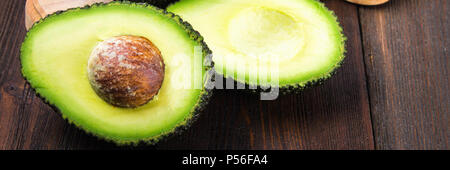 avocado on a dark wood background. tinting. selective focus Stock Photo