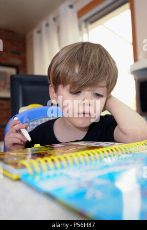 Montreal, Canada, June 24, 2018. Young 3 year-old boy learning how to read.Credit:Mario Beauregard/Alamy Live News Stock Photo