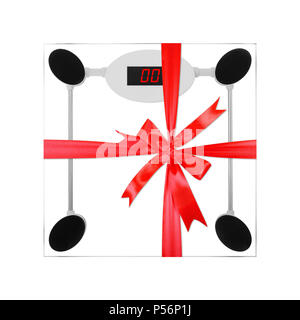 Household appliances - Bathroom digital scales  gift tied red bow from transparent glass on an white background. Stock Photo